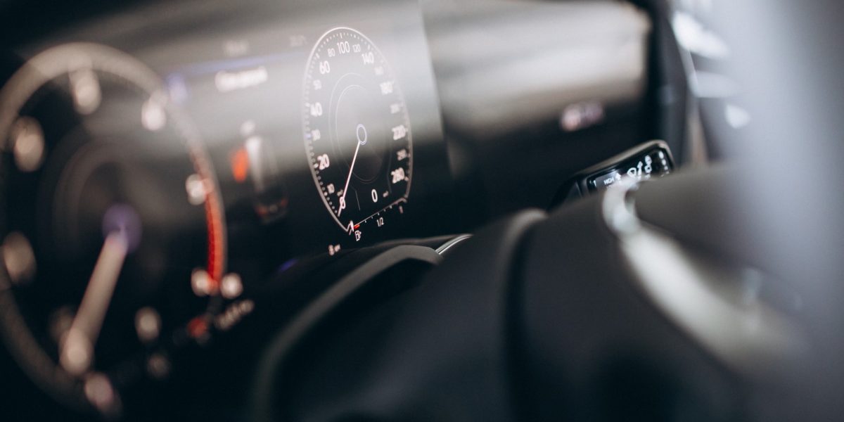 Car dashboard and wheel close up
